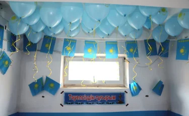 Түркістанда тұрғындар көпқабатты үйді мемлекеттік тумен безендірді